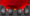 Rear underside view of a red multi-axle trailer/vehicle showing four large tires and exposed axles against a gray background.